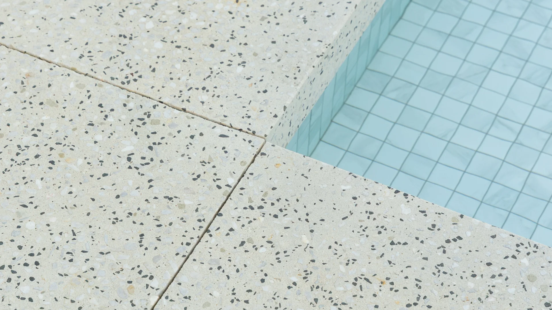 Aerial view of luxury infinity pool with polished concrete surround by Proform Concrete Co Melbourne